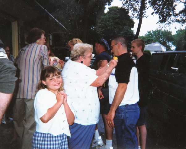 Mary Beth Currier pins a corsage on George Cummins